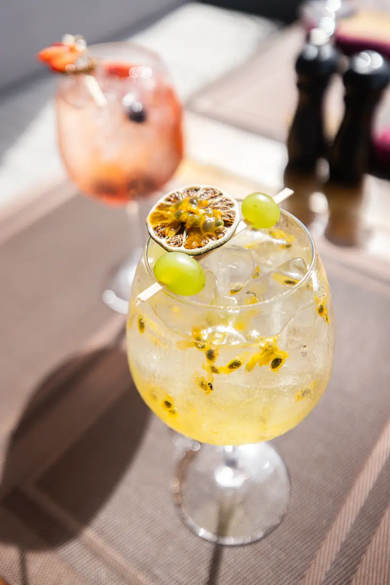 House signature cocktail with tropical garnish