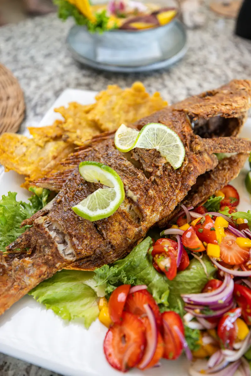 Whole fried fish with citrus and garden salad